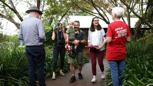 Member for Kiama Gareth Ward (left) campaigning at Mount Terry Public School on election day as Labor candidate Katelin McInerney turns up to vote. Picture: Jane Dempster
