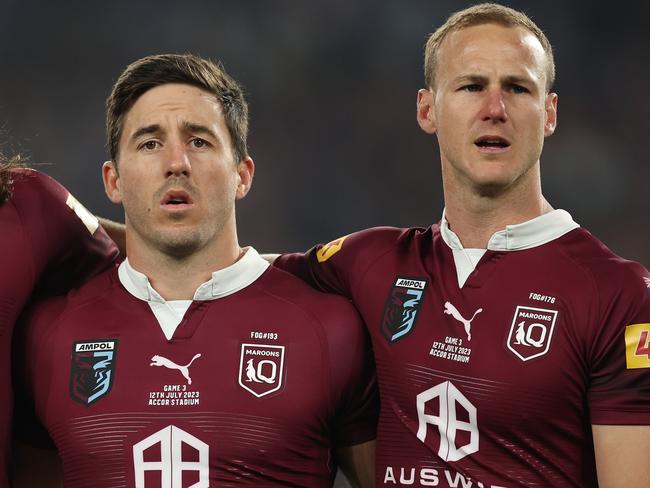 SYDNEY, AUSTRALIA - JULY 12:   Tino Fa'asuamaleaui, Ben Hunt and Daly Cherry-Evans of the Maroons stand and sing the national anthem during game three of the State of Origin series between New South Wales Blues and Queensland Maroons at Accor Stadium on July 12, 2023 in Sydney, Australia. (Photo by Mark Kolbe/Getty Images)