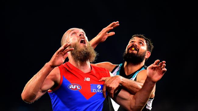 Max Gawn and Patrick Ryder battle for the ball during the round 14 match at Adelaide Oval on Friday night. Picture: GETTY