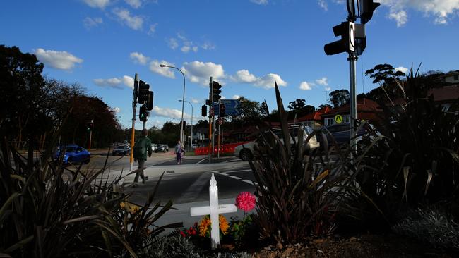 A white cross stands over the crossing where Jo-Ann Thwaites was killed — the intersection of Condamine St and Old Pittwater Rd. Picture: Troy Snook.