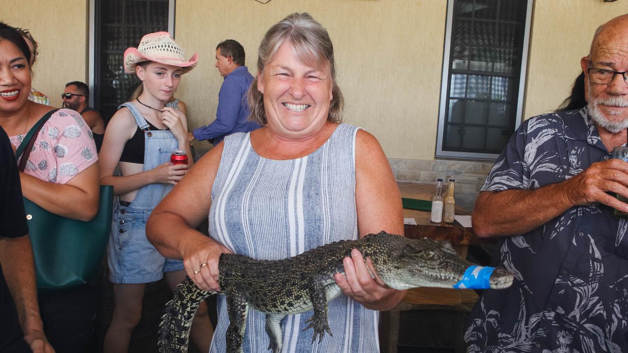 Croc racing at the Berry Springs Tavern for Melbourne Cup Day: Carol Fogarty with race one winner ‘Crocodile Dundee’. Picture: GLENN CAMPBELL