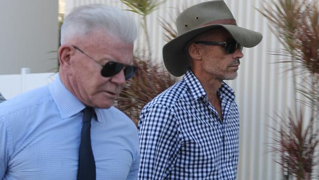 Former Darwin City Councillor Paul Arnold with his barrister Jon Tippett going into Darwin Local Court to face stalking and domestic violence related charges on Monday, May 20. Picture: Zizi Averill