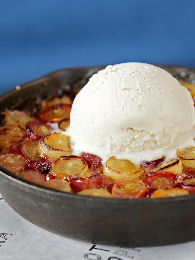 Sotto Sopra's signature wood-fired caramelised grape tart with homemade earl grey ice cream. Picture: Troy Snook