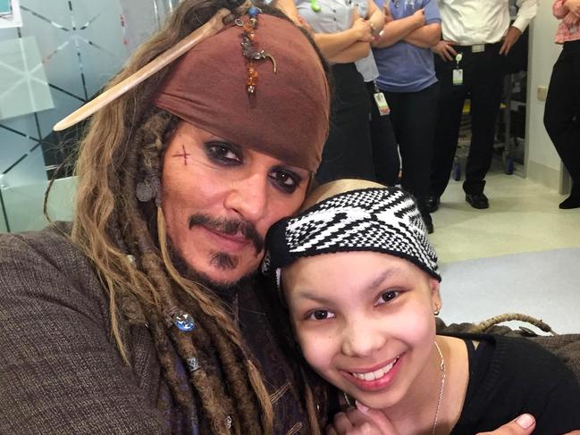 Pirates of the Caribbean Captain jack Sparrow Jonney Depp made a very special visit to the The Lady Cilento Children's Hospital in South Brisbane where he gave out gold coins from the movie to the children in hospital.Pictured is patient Ula Pryce-Davis 13yrs with Pirate coins she got from depp.