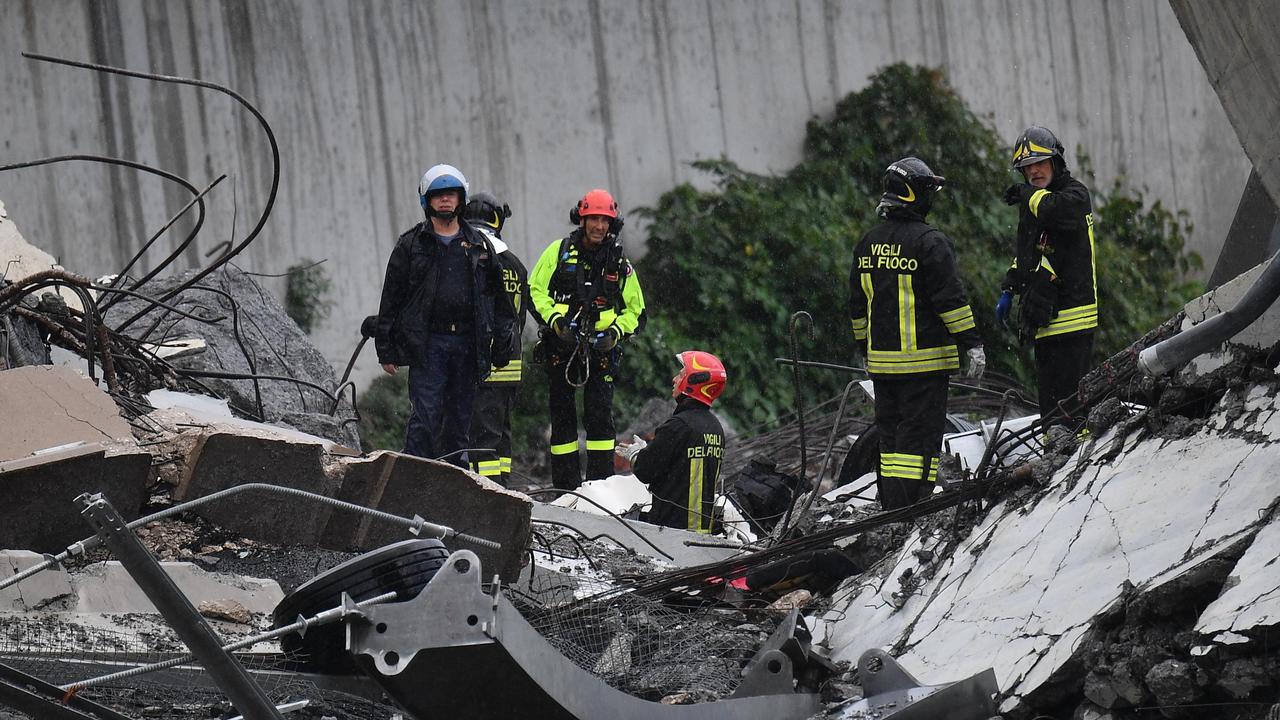 Rescues work among the debris of the collapsed Morandi Bridge in Genoa.