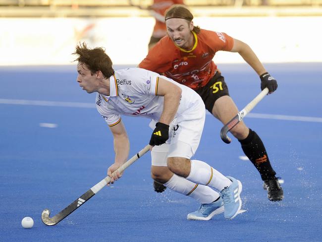 Australia's Tom Harvie pursues Belgium's William Ghislain during the FIH Pro League men's clash. Picture: AFP