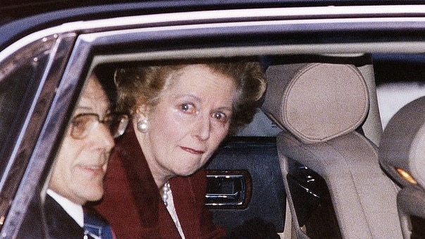 Margaret Thatcher weeps as she leaves Downing St for the last time.