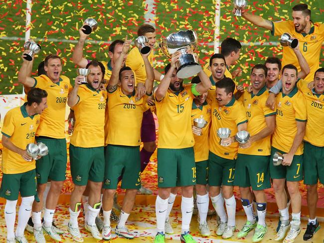 SYDNEY, AUSTRALIA - JANUARY 31: Australia celebrate with the trophy following the 2015 Asian Cup final match between Korea Republic and the Australian Socceroos at ANZ Stadium on January 31, 2015 in Sydney, Australia. (Photo by Brendon Thorne/Getty Images)