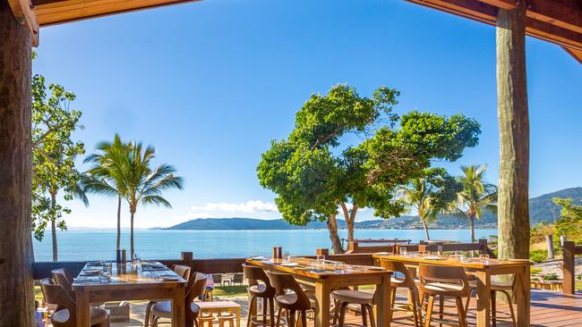 Northerlies Beach Bar and Grill offers a beautiful view of the ocean, looking back toward Airlie Beach for New Years.