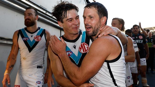 MELBOURNE, AUSTRALIA - MARCH 24: Connor Rozee (left) and Travis Boak of the Power celebrates Boaks 350th match during the 2024 AFL Round 02 match between the Richmond Tigers and the Port Adelaide Power at the Melbourne Cricket Ground on March 24, 2024 in Melbourne, Australia. (Photo by Michael Willson/AFL Photos via Getty Images)