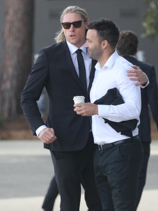 Mark Blicavs and Jimmy Bartel at GMHBA Stadium for Troy Selwood's funeral. Picture: Alan Barber