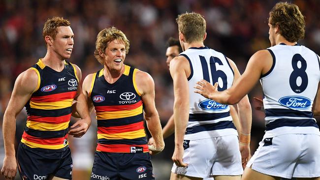 Tom Lynch and Rory Sloane of the Crows face off with Geelong’s Mark Blicavs in the First Preliminary Final. Picture: Daniel Kalisz/Getty Images