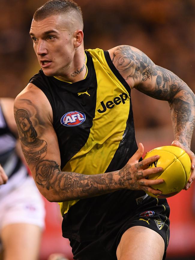 Dustin Martin powers the Tigers into attack in the qualifying final against Geelong.