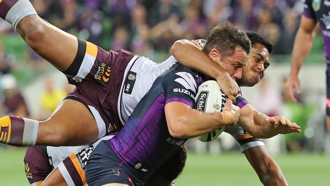 MELBOURNE, AUSTRALIA — MARCH 16: Cooper Cronk of the Melbourne Storm is tackled by Anthony Milford of the Broncos and falls just short of the try line during the round three NRL match between the Melbourne Storm and the Brisbane Broncos at AAMI Park on March 16, 2017 in Melbourne, Australia. (Photo by Scott Barbour/Getty Images)