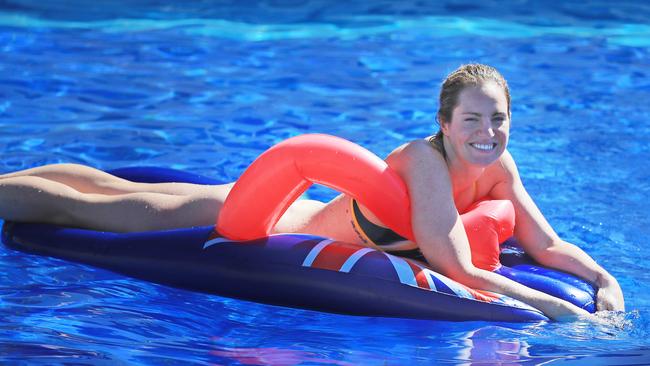 Emily Seebohm floats on a banana lounge in the pool. Picture: Alex Coppel