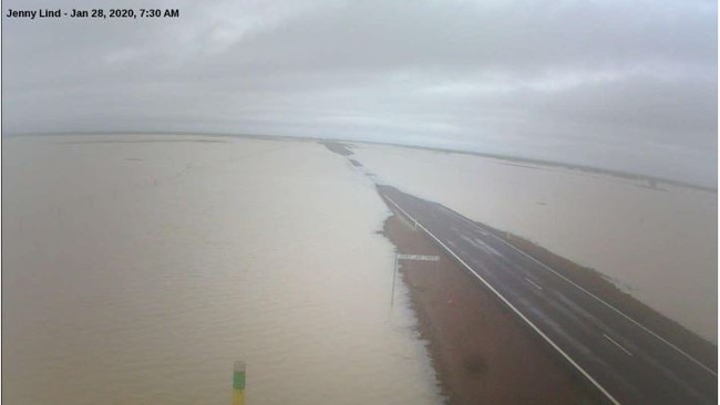 A flood camera from Carpentaria Shire captures a flooded road in Jenny Lind Creek in Carpentaria, Gulf Country at 7:30am this morning.