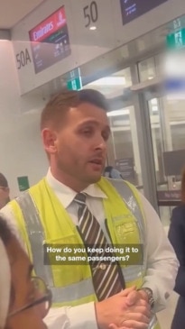 Emirates passengers confront a besieged worker at Perth airport