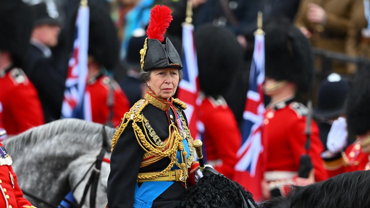 Princess Anne rides on horseback behind the gold state coach carrying the newly crowned King and Queen. Picture: Getty Images