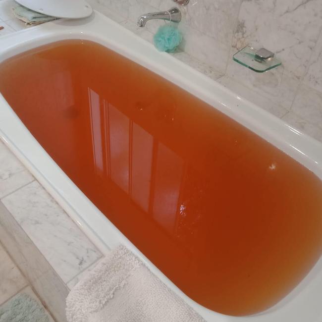 A photo reportedly taken of water in a bathtub at a Couran Cove resident's home before the supply was cut on Saturday. Picture: supplied