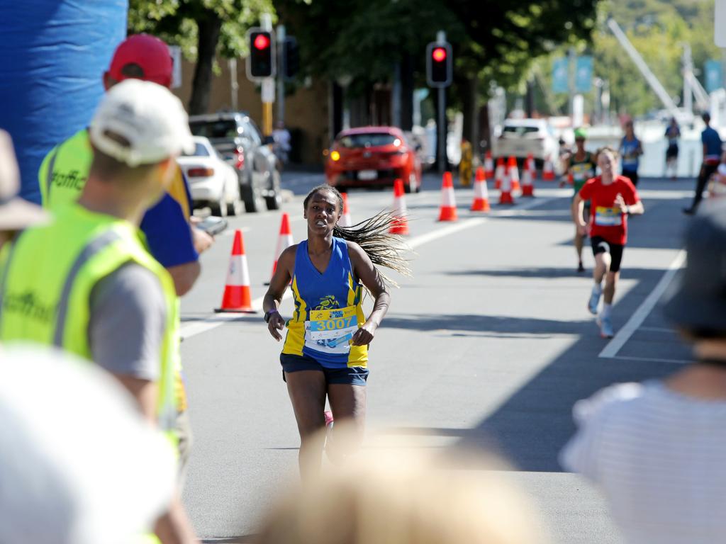 Women's 3km event winner Metasebia Duggan, 13, crosses the finish line in the Race to the Taste. Picture: PATRICK GEE