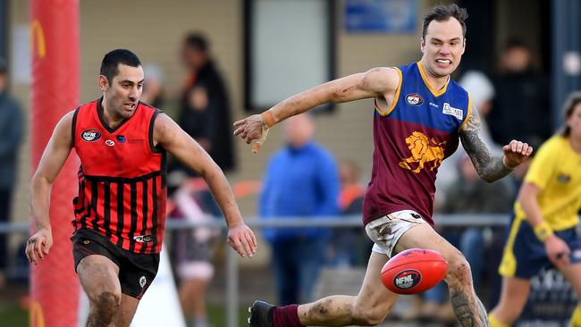 Alek Tsardakis and Aiden Grace keep their eyes on the ball. Picture: Andy Brownbill