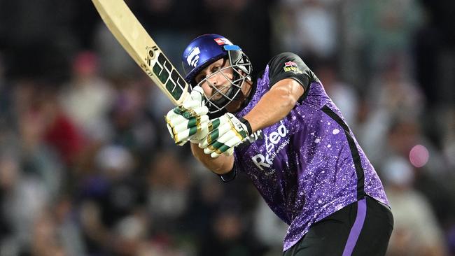 HOBART, AUSTRALIA - JANUARY 14: Tim David of the Hurricanes hits a six during the BBL match between the Hobart Hurricanes and Melbourne Renegades at Blundstone Arena, on January 14, 2025, in Hobart, Australia. (Photo by Steve Bell/Getty Images)