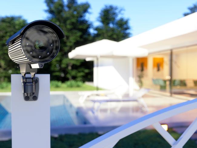 Exterior Of A Villa With Security Camera At The Entrance Of The Garden.