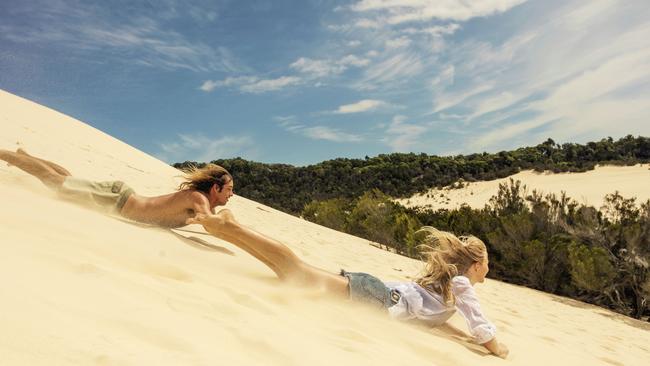 Getting back down Moreton’s sand hills is much more fun than getting up.