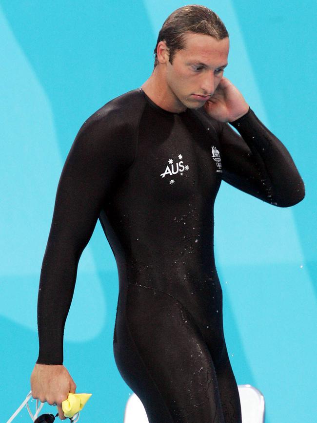 Thorpe leaves the pool deck after a race.