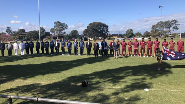 The Royal Australian Navy team alongside umpires, guests and Sunshine Heights players during the national anthems.