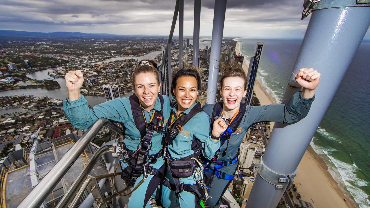 The Gold Coast’s Skypoint Climb leaders Laiken French, Courtney Do and Piper Douglas are gearing up for an influx of tourists in December as the borders open to NSW and Victoria. Picture: Nigel Hallett