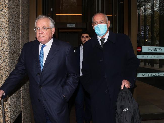 Christopher Dawson (in mask) leaving court with his legal team on May 23. Picture: Gaye Gerard