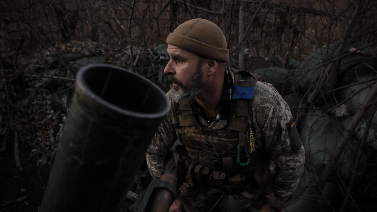 A Ukrainian serviceman of the 24 Separate Mechanized Brigade prepares to fire mortar towards Russian positions near the town of Chasiv Yar, in the Donetsk region. (AFP)