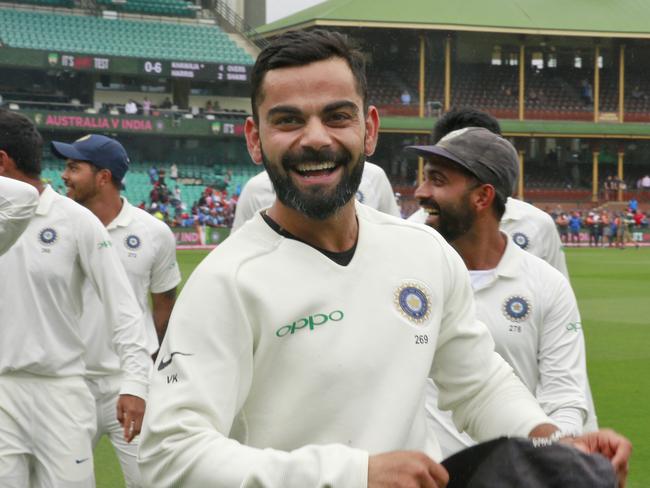 SYDNEY, AUSTRALIA - JANUARY 07: Virat Kohli and the Indian cricket team celebrate winning the series and the BorderGavaskar Trophy during day five of the Fourth Test match in the series between Australia and India at Sydney Cricket Ground on January 07, 2019 in Sydney, Australia. (Photo by Mark Evans/Getty Images)