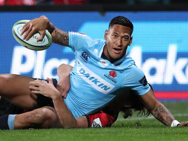 Israel Folau, pictured after scoring a try, was booed by the home crowd.