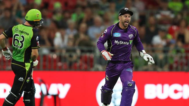 Hobart Hurricanes Matthew Wade celebrates after running out Sydney Thunder's Jos Buttler. Picture: Brett Costello