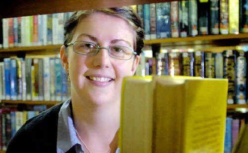 Assistant at the Richmond Upper Clarence Regional Library Richmond Branch, Kate Warner, with a selection of her favourite books. . Picture: Jay Cronan