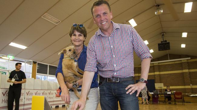 Scott Emerson and his wife Robyn vote at Ironside State School on Saturday but despite a strong showing in the primary vote, he was unable to get over the line. Picture: AAP/Glenn Hunt