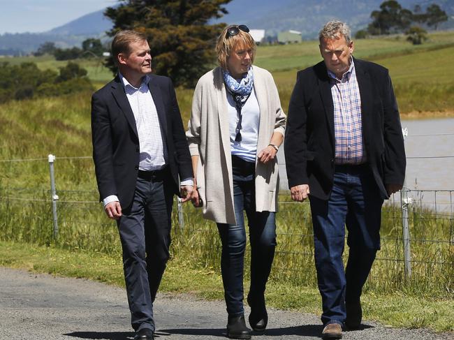 University Vice-Chancellor Professor Peter Rathjen launches $120,00 scholarship Tasmanian boot brand Blundstone - long synonymous with the StateÕs farming sector - will provide $120,000 to support students undertaking new associate degrees in agribusiness next year, picture of from left, University Vice-Chancellor Professor Peter Rathjen,.. University college principle Prof Janelle Allison and Blundstones CEO Steve Gunn, at a Richmond farm Springfield. Picture: KIM EISZELE