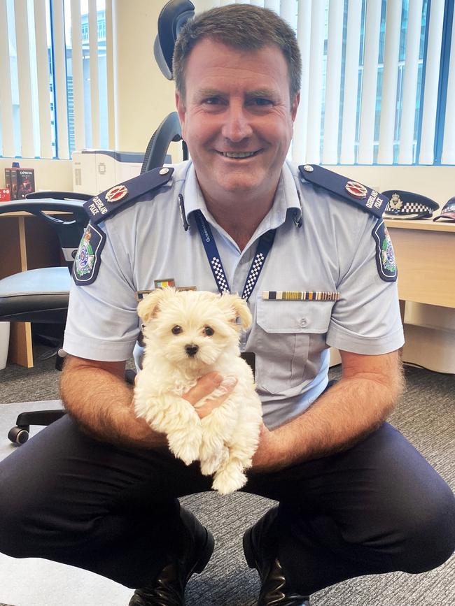 Assistant Commissioner Ben Marcus with an aspiring police dog