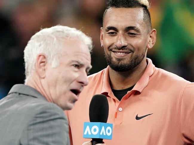 Nick Kyrgios of Australia (right) is interviewed by John McEnroe (left) after winning his first round match against Lorenzo Sonego of Italy on day two of the Australian Open tennis tournament at Melbourne Arena in Melbourne, Tuesday, January 21, 2020. (AAP Image/Dave Hunt) NO ARCHIVING, EDITORIAL USE ONLY