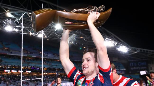 SYDNEY, AUSTRALIA — SEPTEMBER 30: Luke Keary of the Roosters holds up the Provan-Summons Trophy as he celebrates victory in the 2018 NRL Grand Final match between the Melbourne Storm and the Sydney Roosters at ANZ Stadium on September 30, 2018 in Sydney, Australia. (Photo by Mark Kolbe/Getty Images)