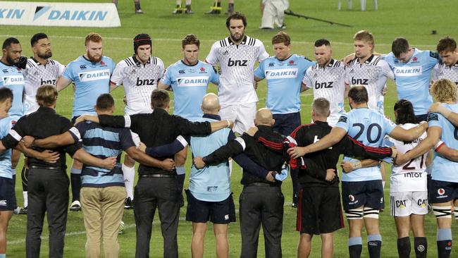 The Waratahs and the Crusaders Super Rugby teams join together for a moment of silence for the New Zealand shooting victims. Pic: AP 