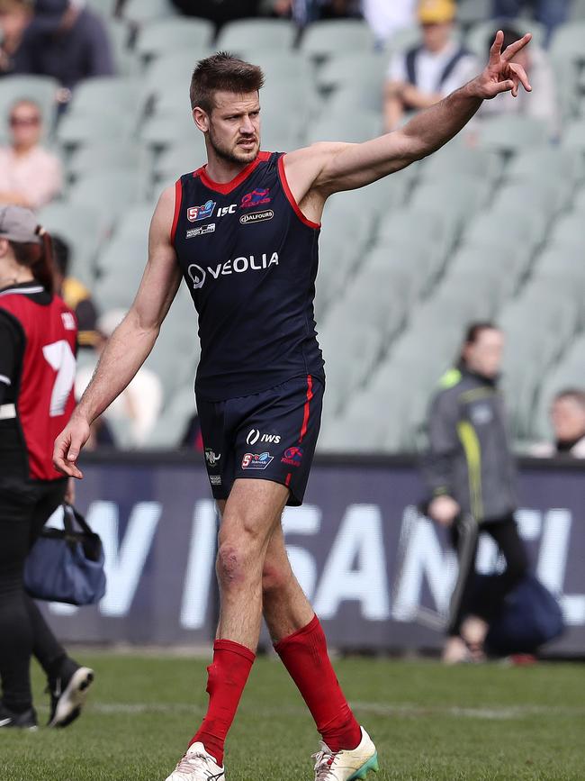 The retiring Brady Dawe waves to Redlegs fans after his final game for the club last year/ Picture: Sarah Reed