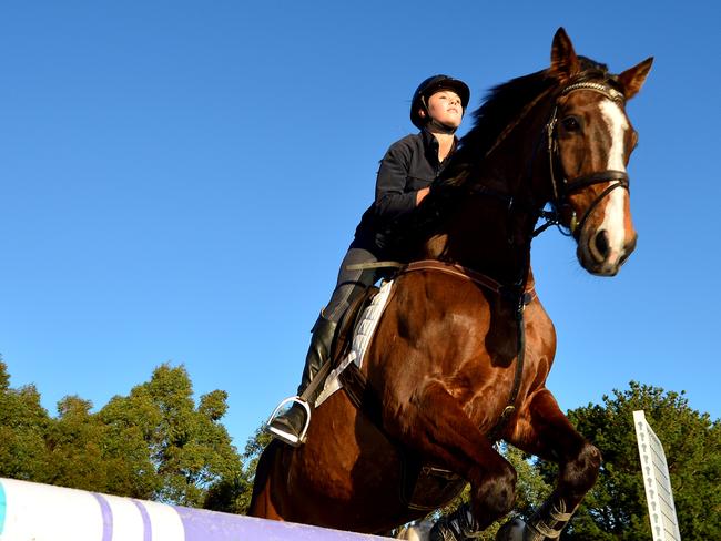 Pictured is Jasmin Dennison, a Toorak College student and rising equestrian star on the Mornington Peninsula. With Bubble and Squeak. Picture: Derrick den Hollander