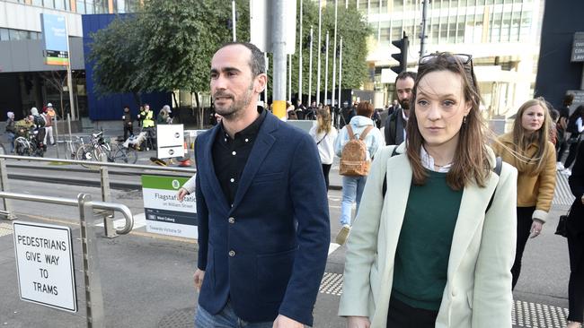 Moz Azimitabar walking into court on Thursday flanked by activist Sally Rugg. . Picture: NCA NewsWire / Andrew Henshaw