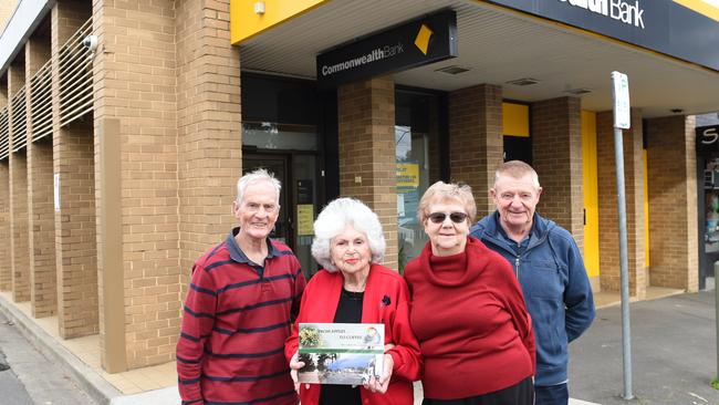 Historians (from left) Gerry Robinson, Rita James, Betty Colbert and Jeff Leipold in front of the Commonwealth Bank in Heathmont, which is closing down. Picture: Lawrence Pinder