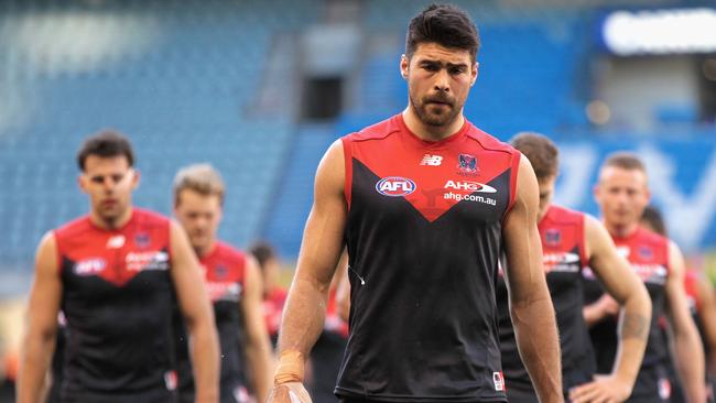 Chris Dawes leads Melbourne players off Etihad Stadium.