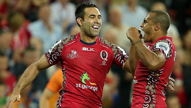 Qld Reds vs The Highlanders, at Suncorp Stadium. Rod Davies and Will Genia celebrate a second half try in 2014. Picture: Jono Searle