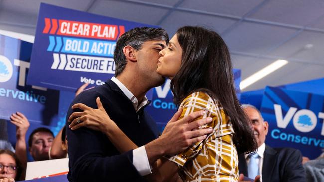 Rishi Sunak and his wife Akshata Murty kiss during his final rally at Romsey Rugby Football Club, in Romsey, Hampshire. Picture: AFP